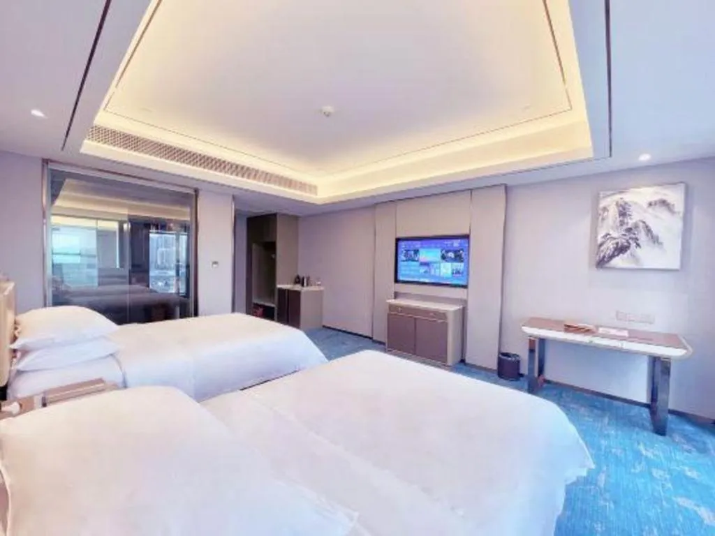 Bed in Venus Royal Hotel Guangxi Wuzhou Sanqicheng Meiguihu Park