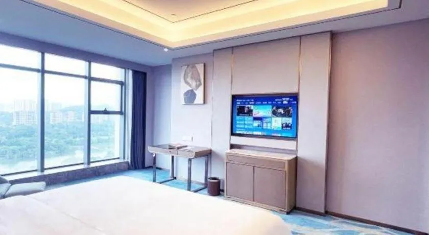 Bed in Venus Royal Hotel Guangxi Wuzhou Sanqicheng Meiguihu Park