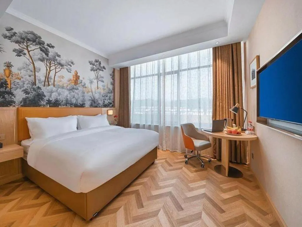 Bed in Vienna Hotel Jiangxi Ganzhou Ningdu Bus Station