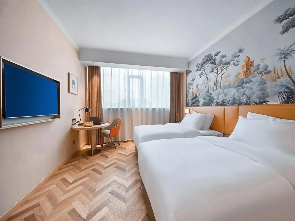 Bed in Vienna Hotel Jiangxi Ganzhou Ningdu Bus Station