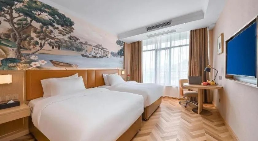 Bed in Vienna Hotel Jiangxi Ganzhou Ningdu Bus Station