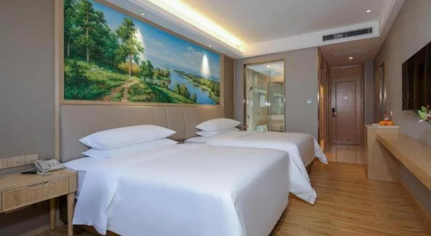 Bed in Vienna Hotel Zhuhai Huafashangdu Nanping Science Industrial Park