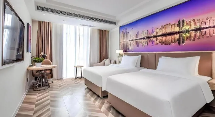 Bed in Vienna Hotel Sichuan Hejiang Yangtze River Bridge