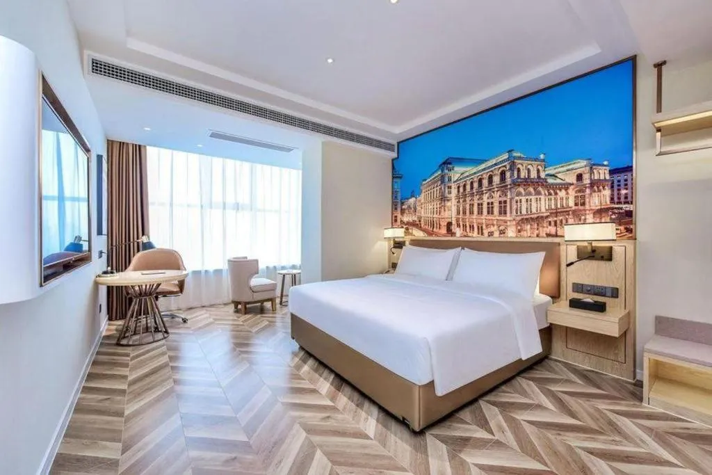 Bed in Vienna Hotel Sichuan Hejiang Yangtze River Bridge