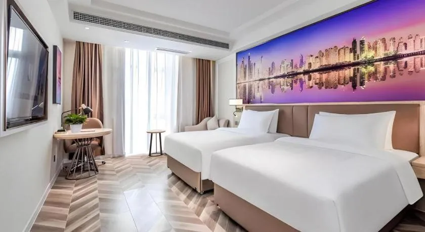 Bed in Vienna Hotel Sichuan Hejiang Yangtze River Bridge