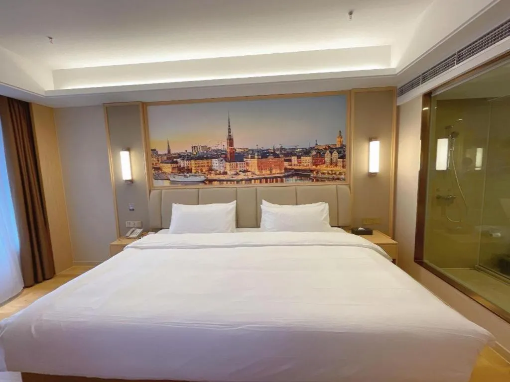 Bed in Vienna Hotel Sichuan Hejiang Yangtze River Bridge