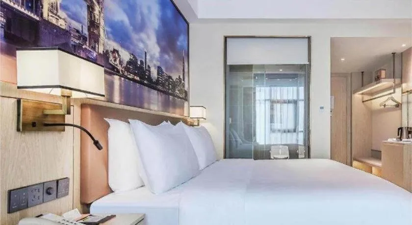 Bed in Vienna Hotel Sichuan Hejiang Yangtze River Bridge