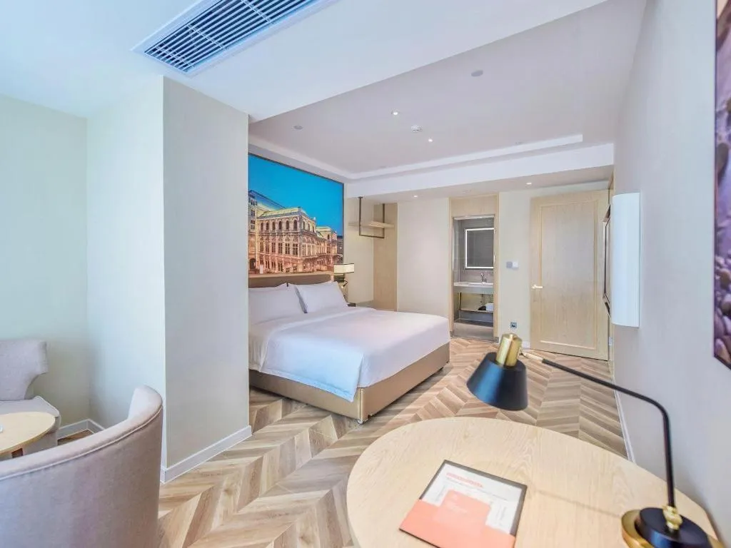 Bed in Vienna Hotel Sichuan Hejiang Yangtze River Bridge