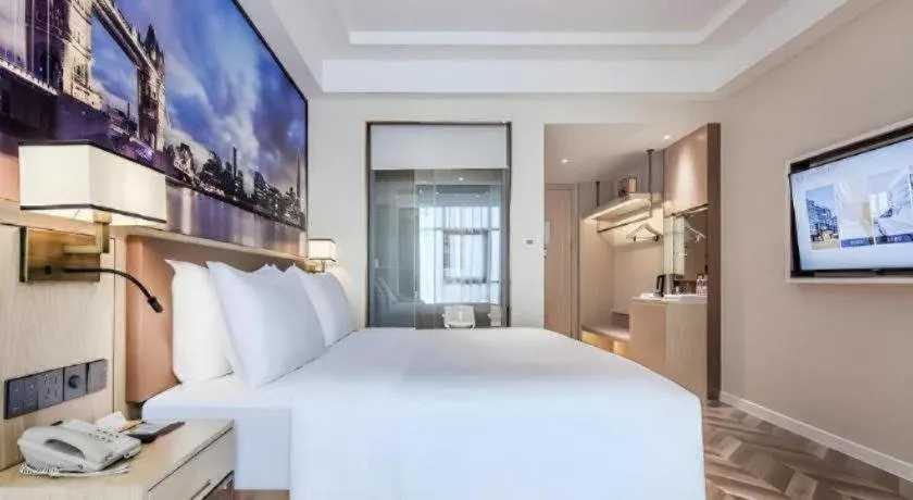 Bed in Vienna Hotel Sichuan Hejiang Yangtze River Bridge