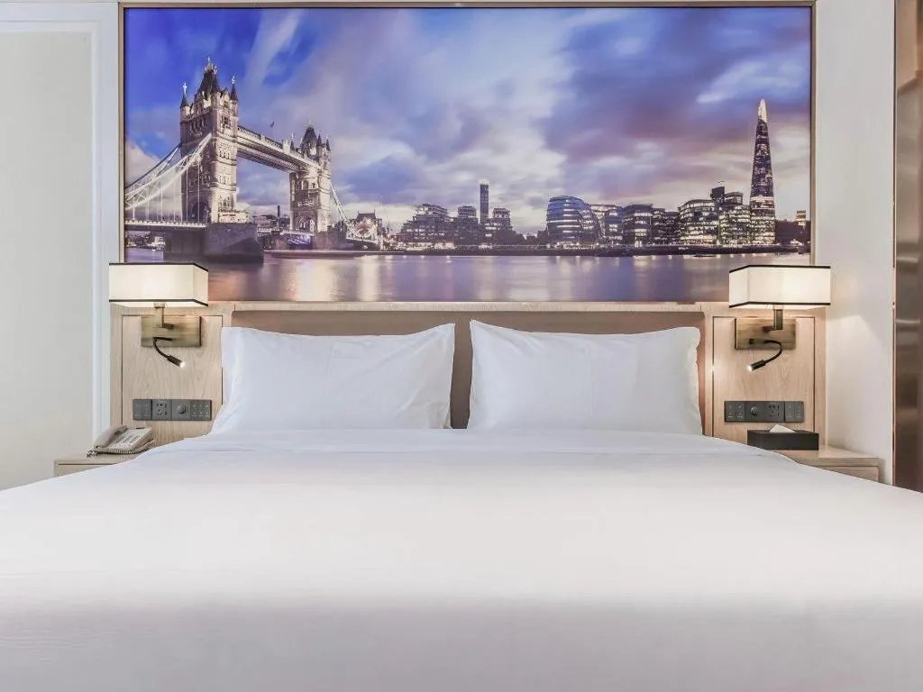 Bed in Vienna Hotel Sichuan Hejiang Yangtze River Bridge