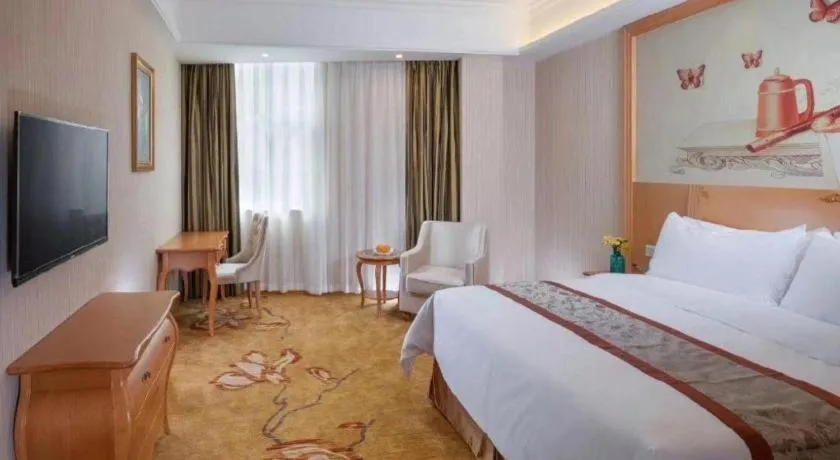 Bed in Vienna Hotel Guangxi Beiliu Passenger Station