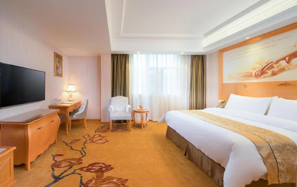 Bed in Vienna Hotel Guangxi Beiliu Passenger Station