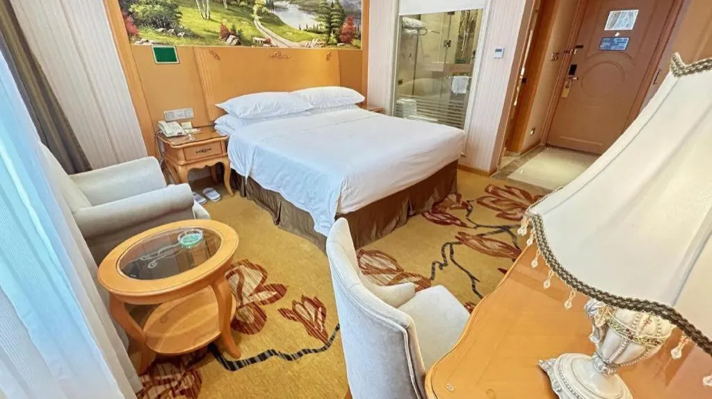 Bed in Vienna Hotel Guangxi Beiliu Passenger Station