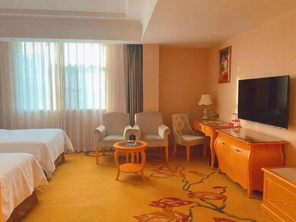 Bed in Vienna Hotel Guangxi Beiliu Passenger Station