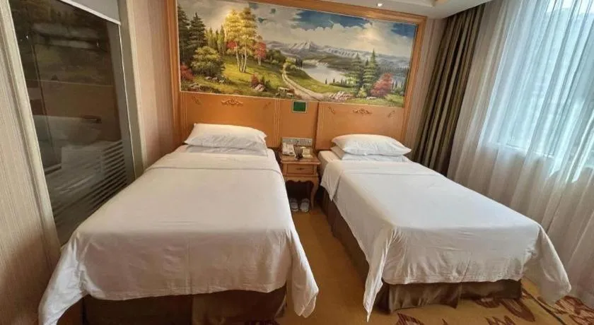 Bed in Vienna Hotel Guangxi Beiliu Passenger Station
