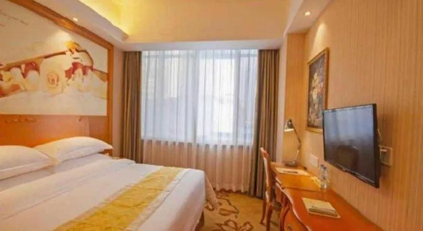 Bed in Vienna Hotel Guangxi Beiliu Passenger Station