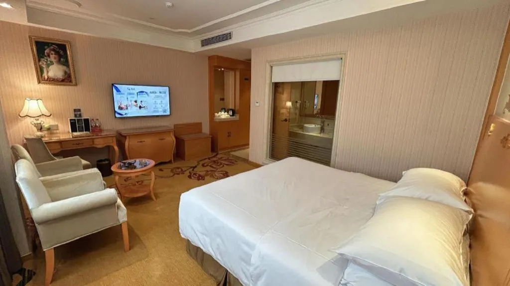 Bed in Vienna Hotel Guangxi Beiliu Passenger Station