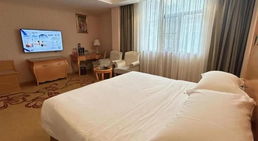 Bed in Vienna Hotel Guangxi Beiliu Passenger Station