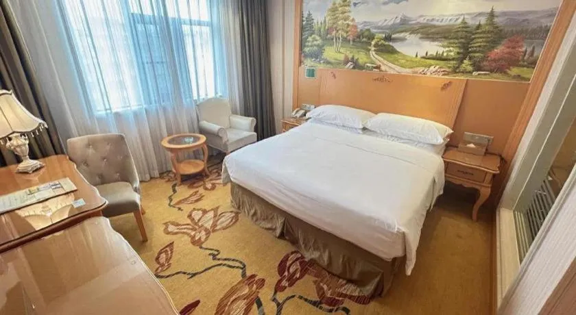 Bed in Vienna Hotel Guangxi Beiliu Passenger Station