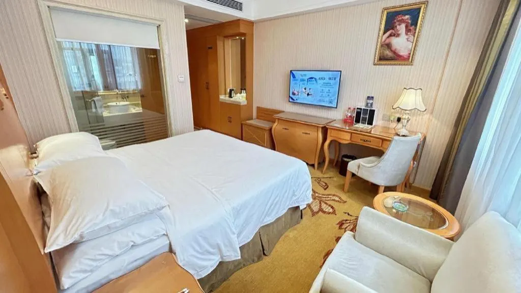 Bed in Vienna Hotel Guangxi Beiliu Passenger Station