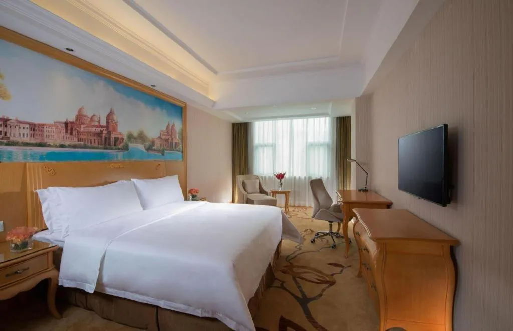 Bed in Vienna Hotel Guangxi Beiliu Passenger Station