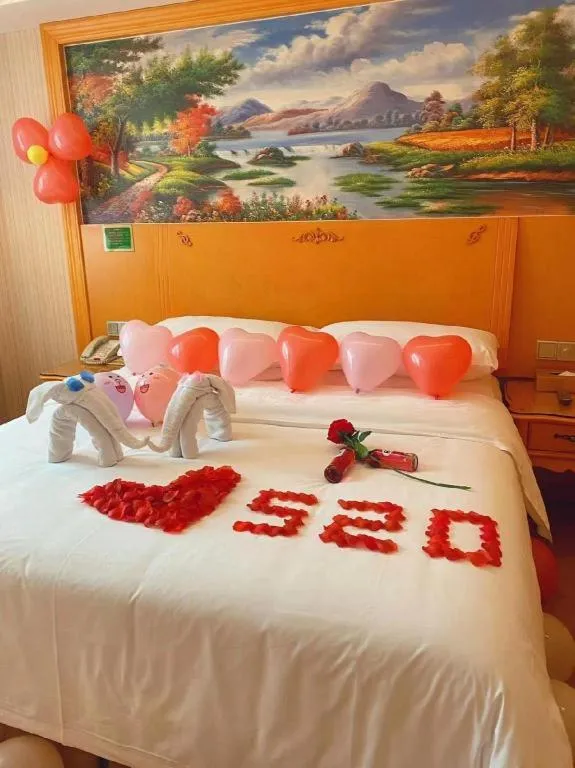 Bed in Vienna Hotel Guangxi Beiliu Passenger Station