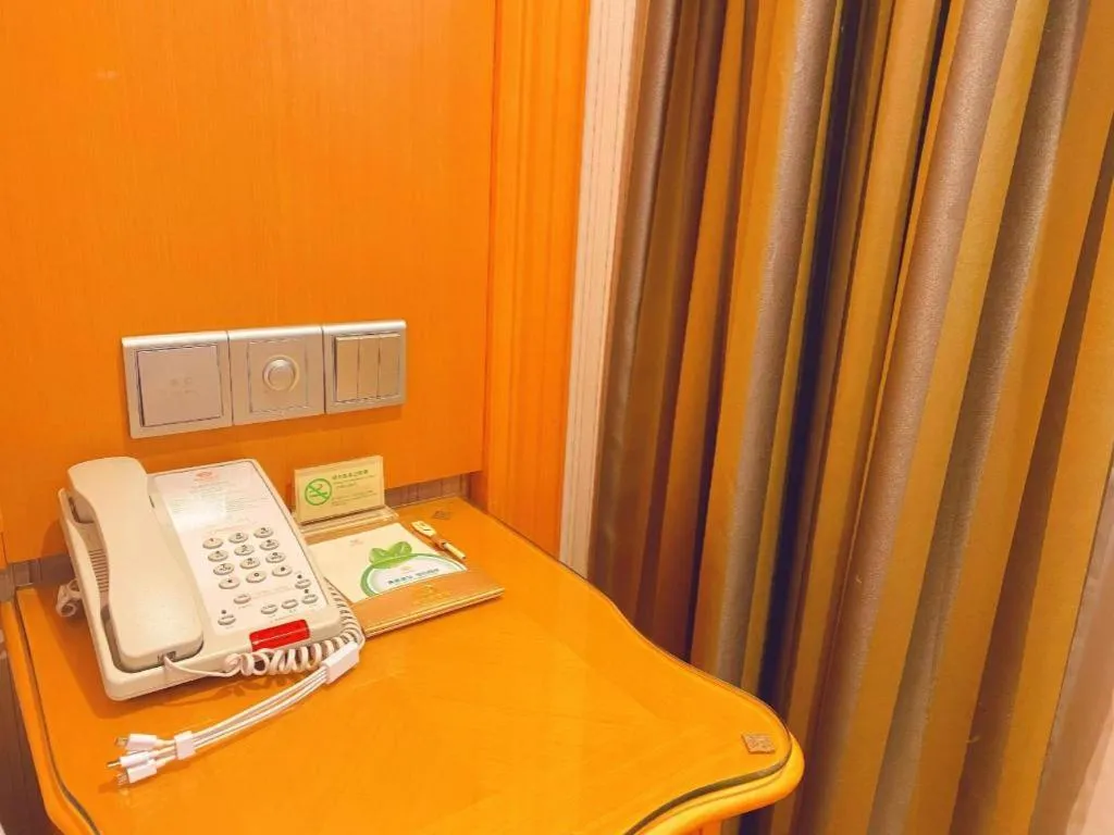 Bed in Vienna Hotel Guangxi Beiliu Passenger Station