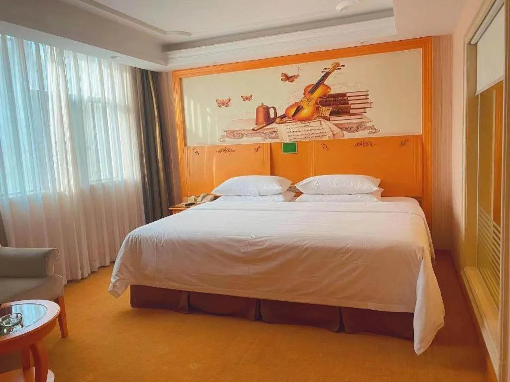 Bed in Vienna Hotel Guangxi Beiliu Passenger Station