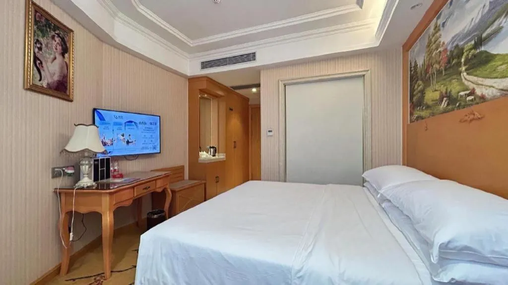 Bed in Vienna Hotel Guangxi Beiliu Passenger Station