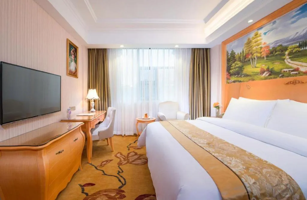 Bed in Vienna Hotel Guangxi Beiliu Passenger Station