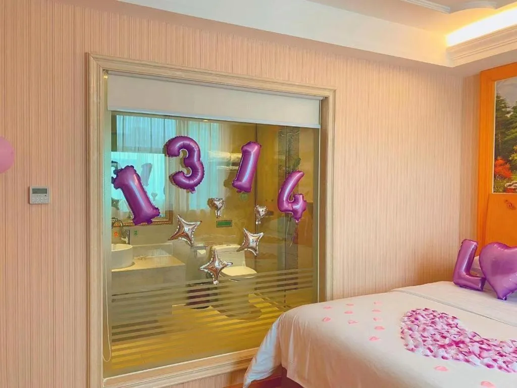 Bed in Vienna Hotel Guangxi Beiliu Passenger Station