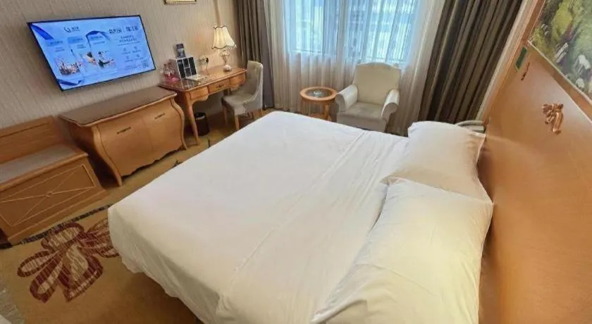 Bed in Vienna Hotel Guangxi Beiliu Passenger Station