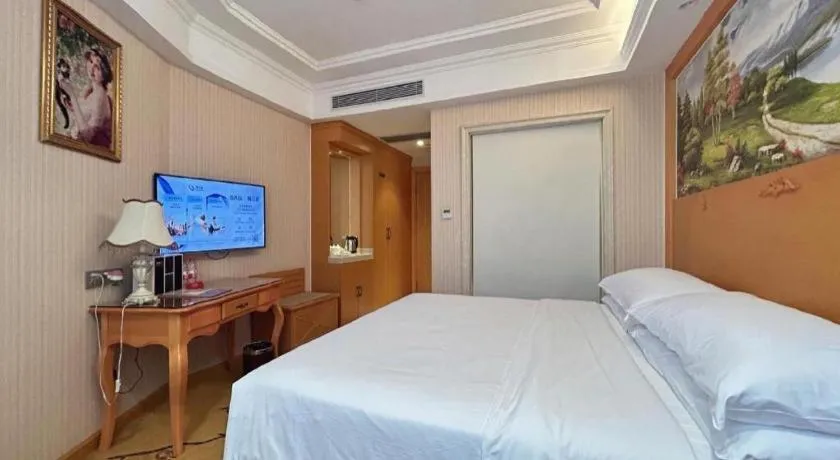 Bed in Vienna Hotel Guangxi Beiliu Passenger Station