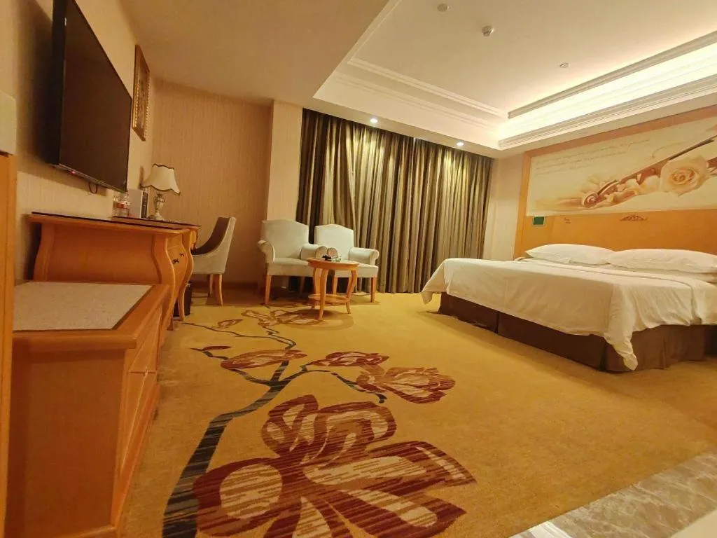 Bed in Vienna Hotel Guangxi Beiliu Passenger Station