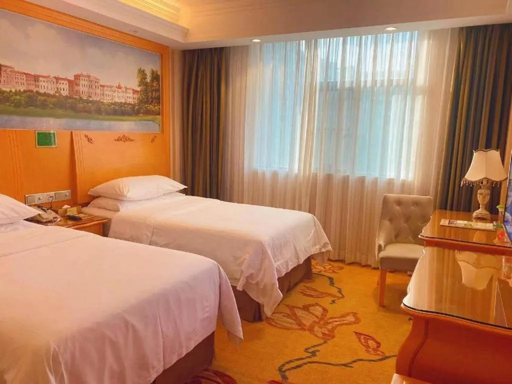 Bed in Vienna Hotel Guangxi Beiliu Passenger Station