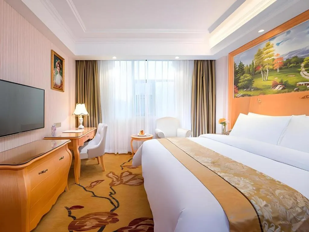 Bed in Vienna Hotel Guangxi Beiliu Passenger Station