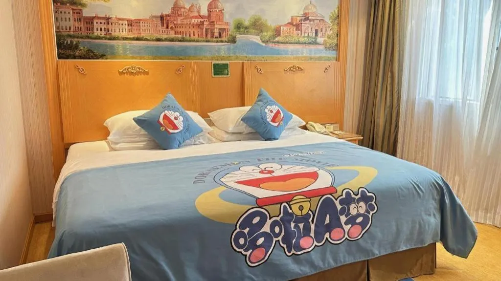Bed in Vienna Hotel Guangxi Beiliu Passenger Station