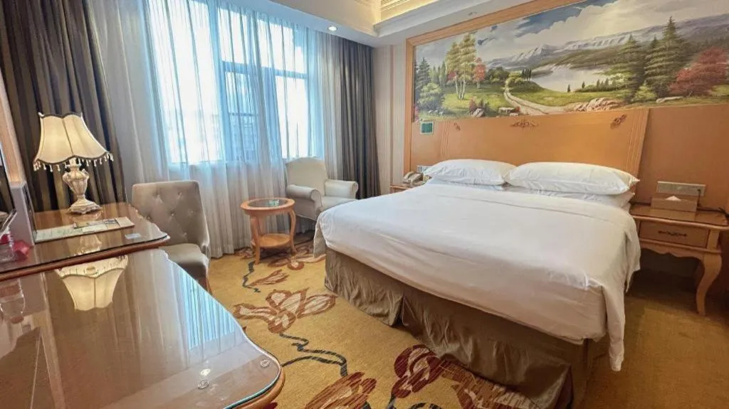 Bed in Vienna Hotel Guangxi Beiliu Passenger Station