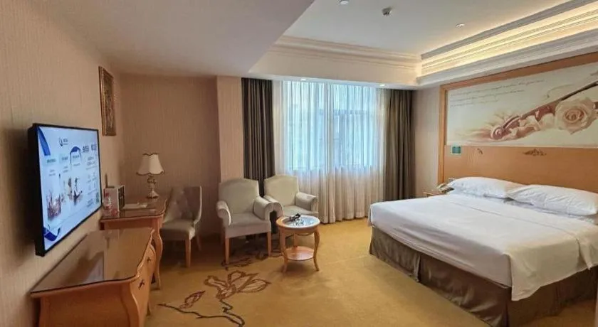 Bed in Vienna Hotel Guangxi Beiliu Passenger Station