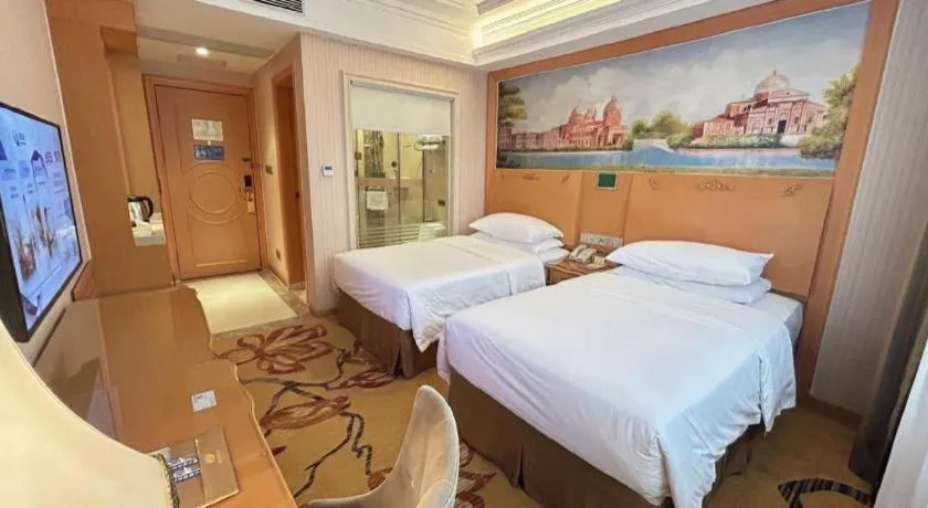 Bed in Vienna Hotel Guangxi Beiliu Passenger Station