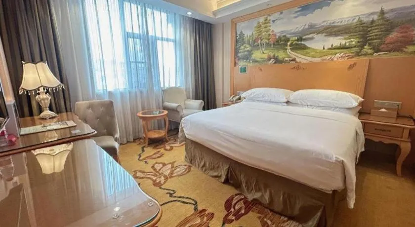 Bed in Vienna Hotel Guangxi Beiliu Passenger Station