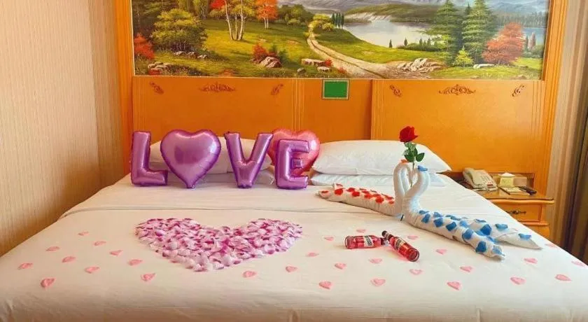 Bed in Vienna Hotel Guangxi Beiliu Passenger Station