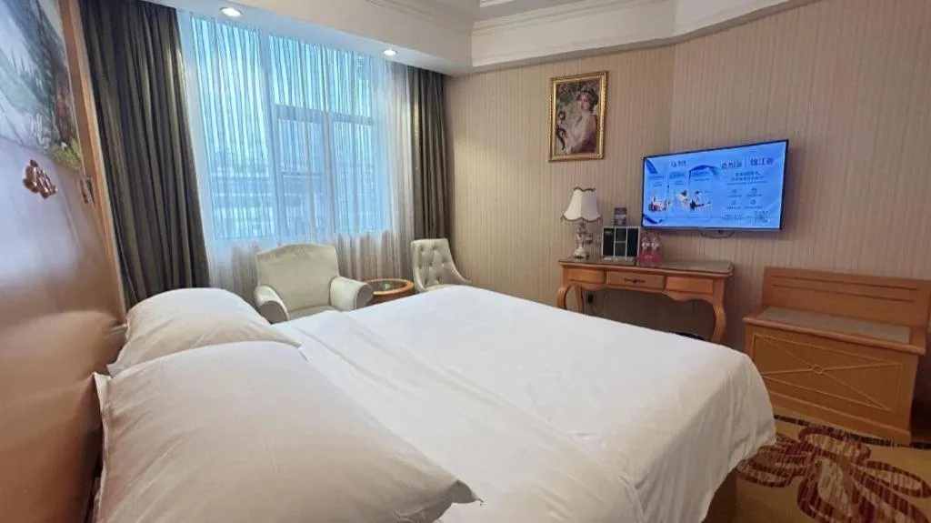 Bed in Vienna Hotel Guangxi Beiliu Passenger Station