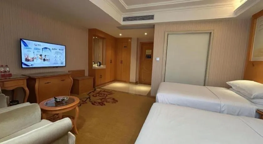 Bed in Vienna Hotel Guangxi Beiliu Passenger Station