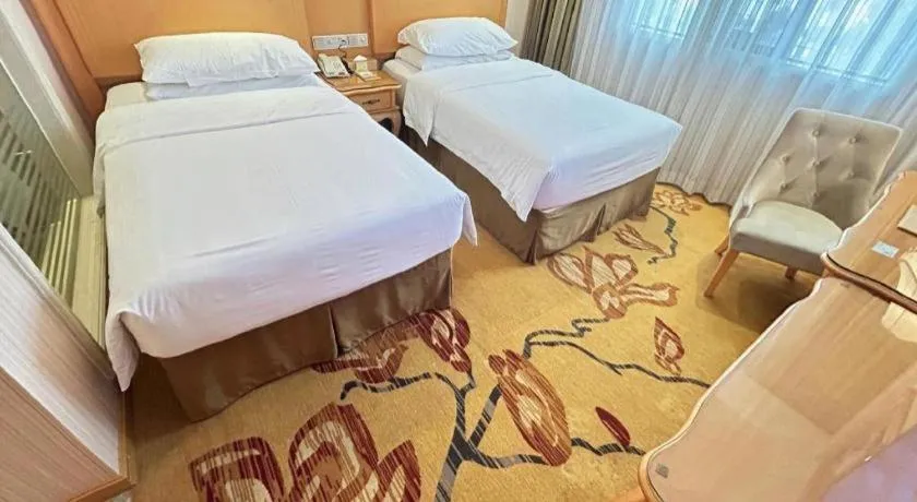 Bed in Vienna Hotel Guangxi Beiliu Passenger Station