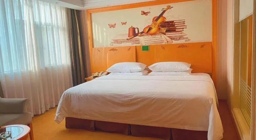 Bed in Vienna Hotel Guangxi Beiliu Passenger Station