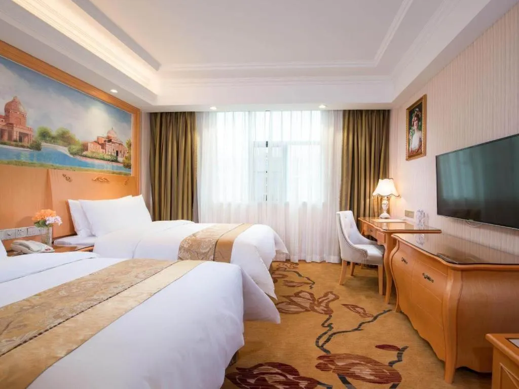 Bed in Vienna Hotel Guangxi Beiliu Passenger Station