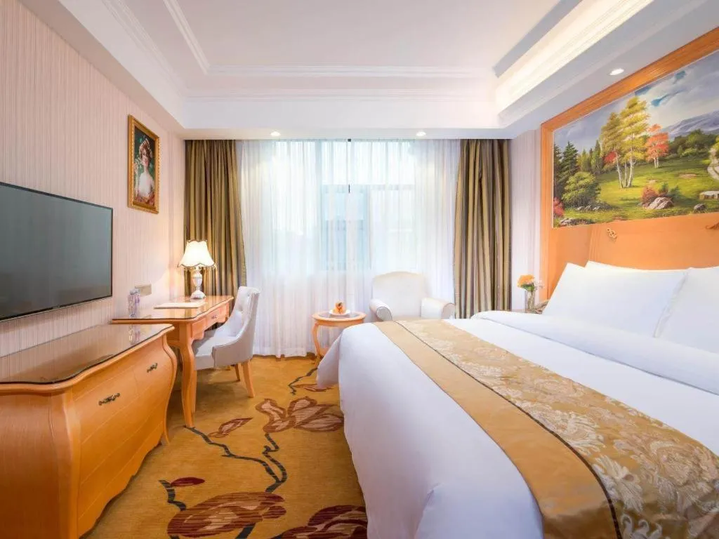 Bed in Vienna Hotel Guangxi Beiliu Passenger Station