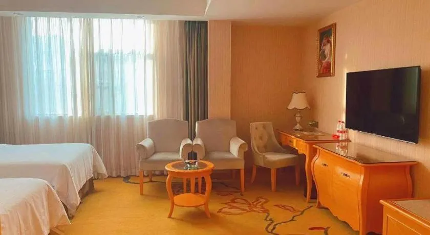 Bed in Vienna Hotel Guangxi Beiliu Passenger Station