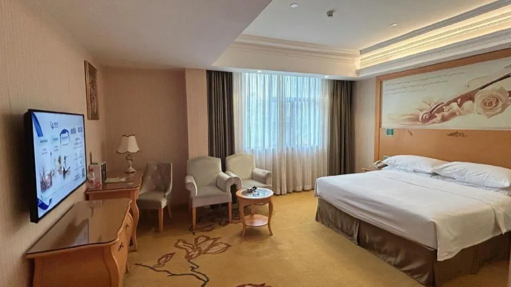 Bed in Vienna Hotel Guangxi Beiliu Passenger Station